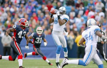 ORCHARD PARK, NY - NOVEMBER 14: Calvin Johnson #81 of the Detroit Lions makes a catch behind Bryan Scott #43 of the Buffalo Bills  at Ralph Wilson Stadium on November 14, 2010 in Orchard Park, New York. Buffalo won 14-12. (Photo by Rick Stewart/Getty Imag
