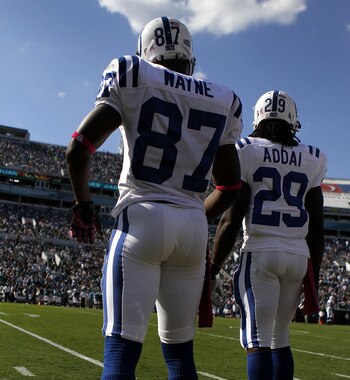 JACKSONVILLE, FL - OCTOBER 03:  Receiver Reggie Wayne #87 and Joseph Addai #29 of the Indianapolis Colts stands on the sideloines while taking on the Jacksonville Jaguars at EverBank Field on October 3, 2010 in Jacksonville, Florida. The Jaguars won 31-28