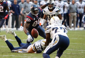 HOUSTON - NOVEMBER 07:  Wide receiver Andre Johnson #80 of the Houston Texans loses the ball as strong safety  Paul Oliver #27 of the San Diego Chargers interecepts the ball at Reliant Stadium on November 7, 2010 in Houston, Texas.  (Photo by Bob Levey/Ge