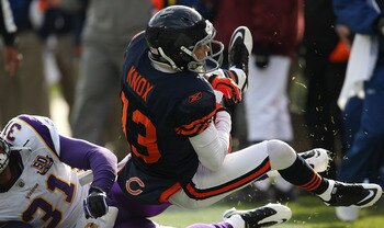 CHICAGO - NOVEMBER 14: Johnny Knox #13 of the Chicago Bears is tackled by Chris Cook #31 of the Minnesota Vikings at Soldier Field on November 14, 2010 in Chicago, Illinois. The Bears defeated the Vikings 27-13. (Photo by Jonathan Daniel/Getty Images)