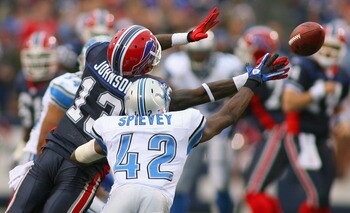 ORCHARD PARK, NY - NOVEMBER 14: Steve Johnson #13 of the Buffalo Bills and Amari Spievey #42 of the Detroit Lions unsuccessfully try to catch a pass at Ralph Wilson Stadium on November 14, 2010 in Orchard Park, New York. Buffalo won 14-12. (Photo by Rick