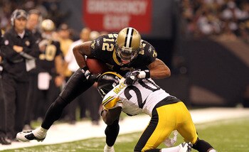 NEW ORLEANS, LA - OCTOBER 31: Marques Colston #12 of the New Orleans Saints is tackled by Bryant McFadden #20 of the Pittsburgh Steelers at the Louisiana Superdome on October 31, 2010 in New Orleans, Louisiana. (Photo by Matthew Sharpe/Getty Images)