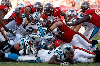 TAMPA, FL - NOVEMBER 14:  Quarterback Jimmy Clausen #2 of the Carolina Panthers is stopped short of the goal line by the Tampa Bay Buccaneers defense during the game at Raymond James Stadium on November 14, 2010 in Tampa, Florida.  (Photo by J. Meric/Gett