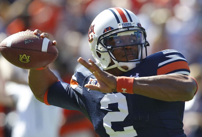 AUBURN, AL - OCTOBER 16:  Quarterback Cam Newton #2 of the Auburn Tigers throws a practice pass before the game against the Arkansas Razorbacks at Jordan-Hare Stadium on October 16, 2010 in Auburn, Alabama.  (Photo by Mike Zarrilli/Getty Images)