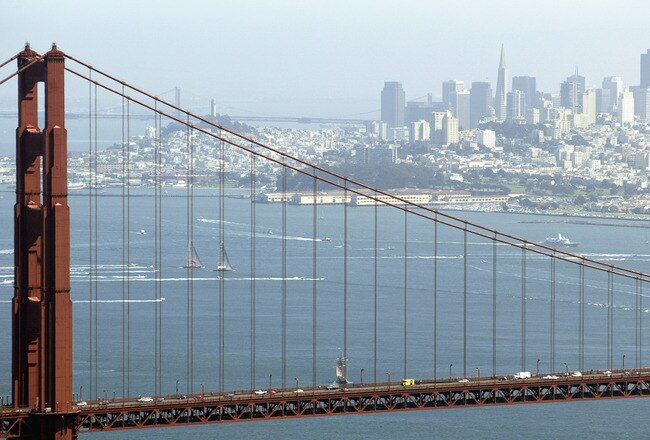 SAN FRANCISCO - SEPTEMBER 16:  Swiss Team Alinghi headed by Ernesto Bertarelli and Oracle BMW Racing team headed by Larry Ellison race during the Moet Cup in the San Francisco Bay on September 16, 2003 in San Francisco, California.  (Photo by Jed Jacobsoh