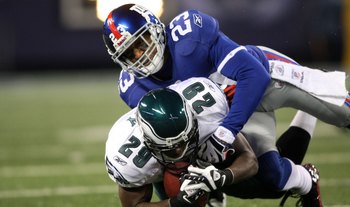 EAST RUTHERFORD, NJ - DECEMBER 13:  LeSean McCoy #29 of the Philadelphia Eagles is tackled by Corey Webster #23 of the New York Giants at Giants Stadium on December 13, 2009 in East Rutherford, New Jersey.  (Photo by Nick Laham/Getty Images)