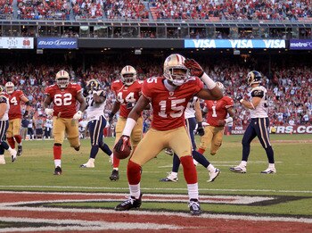 SAN FRANCISCO - NOVEMBER 14:  Michael Crabtree #15 of the San Francisco 49ers celebrates after scoring a touchdown against the St. Louis Rams at Candlestick Park on November 14, 2010 in San Francisco, California.  (Photo by Ezra Shaw/Getty Images)