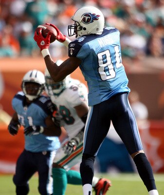 MIAMI - NOVEMBER 14:  Wide receiver Randy Moss #84 of the Tennessee Titans makes a catch against the Miami Dolphins at Sun Life Stadium on November 14, 2010 in Miami, Florida.  (Photo by Marc Serota/Getty Images)