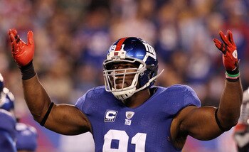 EAST RUTHERFORD, NJ - NOVEMBER 14:  Justin Tuck #91 of the New York Giants reacts against the Dallas Cowboys on November 14, 2010 at the New Meadowlands Stadium in East Rutherford, New Jersey. The Cowboys defeated the Giants 33-20.  (Photo by Jim McIsaac/