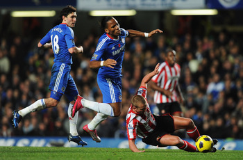 LONDON, ENGLAND - NOVEMBER 14:  Didier Drogba of Chelsea is tackled by Lee Cattermole of Sunderland during the Barclays Premier League match between Chelsea and Sunderland at Stamford Bridge on November 14, 2010 in London, England.  (Photo by Michael Rega