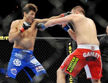LAS VEGAS - NOVEMBER 21: George Sotiropoulos (L) battles Jason Dent (R) during their Lightweight Fight at the UFC 106 at Mandalay Bay Events Center on November 21, 2009 in Las Vegas, Nevada. (Photo by Jon Kopaloff/Getty Images)