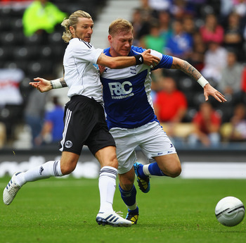 DERBY, ENGLAND - JULY 31:  Robbie Savage of Derby and Garry O'Connor of Birmingham challenge for the ball during the Pre-Season Friendly match between Derby County and Birmingham City at the County Ground on July 31, 2010 in Derby, England.  (Photo by Mat