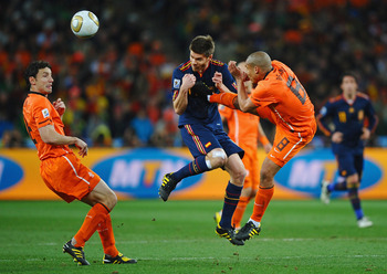 JOHANNESBURG, SOUTH AFRICA - JULY 11: Nigel De Jong of the Netherlands tackles Xabi Alonso of Spain during the 2010 FIFA World Cup South Africa Final match between Netherlands and Spain at Soccer City Stadium on July 11, 2010 in Johannesburg, South Africa