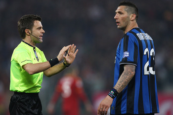 ROME - MAY 05: The referee Nicola Rizzoli (L) talks with Marco Materazzi of FC Internazionale Milano during the Tim Cup between FC Internazionale Milano and AS Roma at Stadio Olimpico on May 5, 2010 in Rome, Italy.  (Photo by Paolo Bruno/Getty Images)