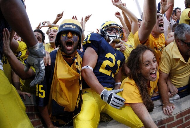 ANN ARBOR, MI - SEPTEMBER 27:  Jordan Reilly #21 of the Michigan Wolverines and fans celebrate their victory over the Wisconsin Badgers on September 27, 2008 at Michigan Stadium in Ann Arbor, Michigan.  (Photo by Gregory Shamus/Getty Images)
