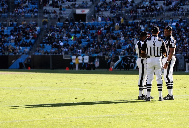 CHARLOTTE, NC - NOVEMBER 07:  A group of referees huddle during their game between the New Orleans Saints and the Carolina Panthers during their game at Bank of America Stadium on November 7, 2010 in Charlotte, North Carolina.  (Photo by Streeter Lecka/Ge