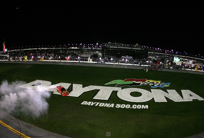 DAYTONA BEACH, FL - FEBRUARY 14:  Jamie McMurray, driver of the #1 Bass Pro Shops/Tracker Boats Chevrolet, celebrates with a burnout after winning the NASCAR Sprint Cup Series Daytona 500 at Daytona International Speedway on February 14, 2010 in Daytona B