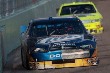 HOMESTEAD, FL - NOVEMBER 21:  Kurt Busch, driver of the #2 Miller Lite Dodge, drives with damage to his car after an accident during the NASCAR Sprint Cup Series Ford 400 at Homestead-Miami Speedway on November 21, 2010 in Homestead, Florida.  (Photo by C