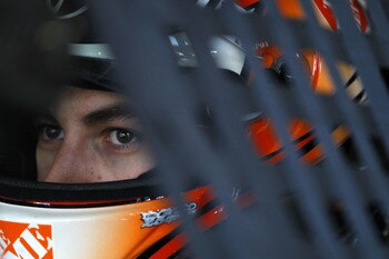 HOMESTEAD, FL - NOVEMBER 20:  Joey Logano, driver of the #20 Home Depot Toyota, sits in his car during practice for the NASCAR Sprint Cup Series Ford 400 at Homestead-Miami Speedway on November 20, 2010 in Homestead, Florida.  (Photo by Chris Trotman/Gett