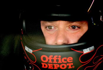 HOMESTEAD, FL - NOVEMBER 20:  Tony Stewart, driver of the #14 Old Spice/Office Depot Chevrolet, sits in his car during practice for the NASCAR Sprint Cup Series Ford 400 at Homestead-Miami Speedway on November 20, 2010 in Homestead, Florida.  (Photo by Ru