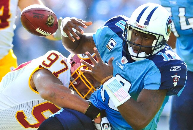 NASHVILLE, TN - NOVEMBER 21:  Lorenzo Alexander #97 of the Washington Redskins forces a fumble by quarterback Vince Young #10 of the Tennessee Titans during the first half at LP Field on November 21, 2010 in Nashville, Tennessee.  (Photo by Grant Halverso