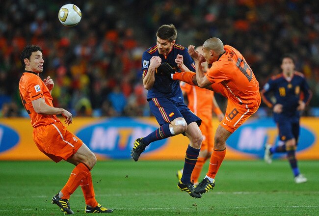 JOHANNESBURG, SOUTH AFRICA - JULY 11: Nigel De Jong of the Netherlands tackles Xabi Alonso of Spain during the 2010 FIFA World Cup South Africa Final match between Netherlands and Spain at Soccer City Stadium on July 11, 2010 in Johannesburg, South Africa