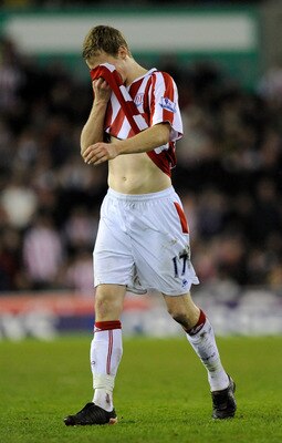 STOKE ON TRENT, ENGLAND - FEBRUARY 27:  Ryan Shawcross of Stoke City leaves the pitch in tears after being sent off for a challenge on Aaron Ramsey of Arsenal during the Barclays Premier League match between Stoke City and Arsenal at The Britannia Stadium