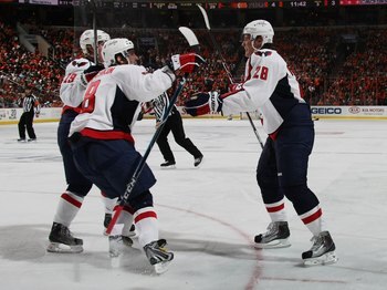 PHILADELPHIA - OCTOBER 06: Nicklas Backstrom #19, Alex Ovechkin #8 and Alexander Semin #28 of the Washington Capitals celebrate Semin's goal against the Philadelphia Flyers at the Wachovia Center on October 6, 2009 in Philadelphia, Pennsylvania. (Photo by