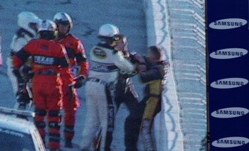 FORT WORTH, TX - NOVEMBER 07:  NASCAR officials break up a fight between Jeff Gordon (2R), driver of the #24 DuPont/National Guard Chevrolet, and Jeff Burton (R), driver of the #31 Caterpillar Chevrolett, as seen on the Sprint Vision screen in the infield