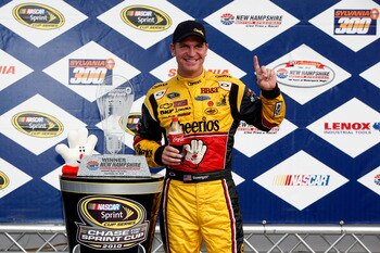 LOUDON, NH - SEPTEMBER 19:  Clint Bowyer, driver of the #33 Cheerios / Hamburger Helper Chevrolet celebrates with the trophy in victory lane after winning the NASCAR Sprint Cup Series Sylvania 300 at New Hampshire Motor Speedway on September 19, 2010 in L