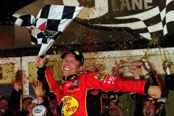 DAYTONA BEACH, FL - FEBRUARY 14:  Jamie McMurray, driver of the #1 Bass Pro Shops/Tracker Boats Chevrolet, celebrates in Victory Lane after winning the NASCAR Sprint Cup Series Daytona 500 at Daytona International Speedway on February 14, 2010 in Daytona