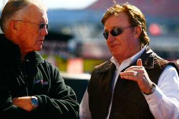 TALLADEGA, AL - OCTOBER 29:  Team owners Joe Gibbs (L) and Richard Childress talk in the garage area during practice for the NASCAR Sprint Cup Series AMP Energy Juice 500 at Talladega Superspeedway on October 29, 2010 in Talladega, Alabama.  (Photo by Jas