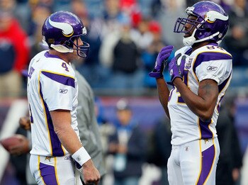 FOXBORO, MA - OCTOBER 31:  Brett Favre #4 of the Minnesota Vikings interacts with teammate Randy Moss #84 before a game against the New England Patriots at Gillette Stadium on October 31, 2010 in Foxboro, Massachusetts. (Photo by Jim Rogash/Getty Images)