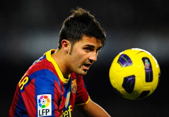 BARCELONA, SPAIN - NOVEMBER 13:  David Villa of Barcelona looks at the ball during the La Liga match between Barcelona and Villarreal CF at Camp Nou Stadium on November 13, 2010 in Barcelona, Spain. Barcelona won the match 3-1.  (Photo by David Ramos/Gett