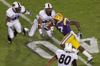 BATON ROUGE, LA - NOVEMBER 13:  Patrick Peterson #7 of the Louisiana State University Tigers runs through the defense of the University of Louisiana-Monroe Warhawks at Tiger Stadium on November 13, 2010 in Baton Rouge, Louisiana.   The Tigers defeated the