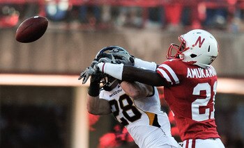LINCOLN, NE - OCTOBER 30: Cornerback Prince Amukamara #21 of the Nebraska Cornhuskers breaks up a pass intended for wide receiver T.J. Moe #28 of the Missouri Tigers during first half action of their game at Memorial Stadium on October 30, 2010 in Lincoln