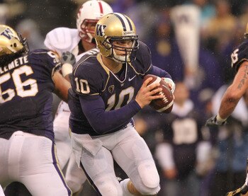 SEATTLE - OCTOBER 30:  Quarterback Jake Locker #10 of the Washington Huskies scrambles against the Stanford Cardinal on October 30, 2010 at Husky Stadium in Seattle, Washington. Stanford won 41-0. (Photo by Otto Greule Jr/Getty Images)