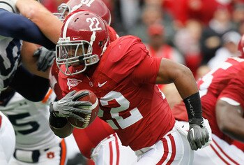 TUSCALOOSA, AL - NOVEMBER 26:  Mark Ingram #22 of the Alabama Crimson Tide rushes for a touchdown against the Auburn Tigers at Bryant-Denny Stadium on November 26, 2010 in Tuscaloosa, Alabama.  (Photo by Kevin C. Cox/Getty Images)