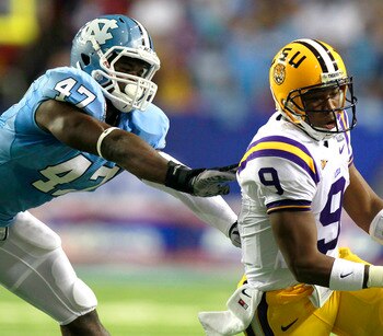 ATLANTA - SEPTEMBER 4: Quarterback Jordan Jefferson #9 of the LSU Tigers rushes upfield away from Zach Brown #47 of the North Carolina Tar Heels at the Georgia Dome September 4, 2010 in Atlanta, Georgia.  (Photo by Kevin C. Cox/Getty Images)
