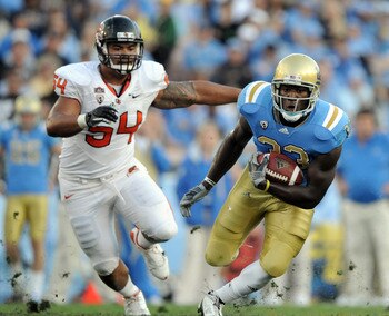 PASADENA, CA - NOVEMBER 06:  Derrick Coleman #33 of the UCLA Bruins runs from Stephen Paea #54 of the Oregon State Beavers at the Rose Bowl on November 6, 2010 in Pasadena, California.  (Photo by Harry How/Getty Images)