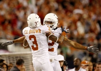 ARLINGTON, TX - DECEMBER 5:  Curtis Brown #3 and Earl Thomas #12 of the Texas Longhorns celebrate breaking up a pass against the Nebraska Cornhuskers in the third quarter at Cowboys Stadium on December 5, 2009 in Arlington, Texas.  (Photo by Ronald Martin