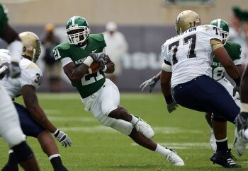 EAST LANSING, MI - SEPTEMBER 15:  Otis Wiley #21 of the Michigan State Spartans runs back his interception past Jason Pinkston #77 of the Pittsburgh Panthers during the first quarter at Spartan Stadium on September 15, 2007 in East Lansing, Michigan. The