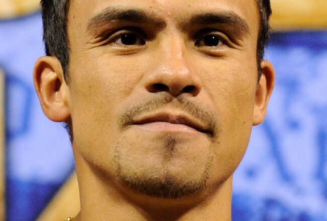 LAS VEGAS - JULY 30:  WBA/WBO lightweight champion Juan Manuel Marquez poses on the scale during the official weigh-in for his fight against Juan Diaz at the Mandalay Bay Events Center July 30, 2010 in Las Vegas, Nevada. Marquez will defend his titles aga