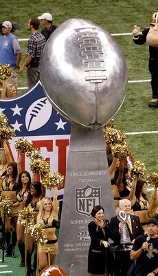 NEW ORLEANS - SEPTEMBER 09:  Harry Connick Jr. leads a float out onto the field which carried the Vince Lombardi Super Bowl Trophy which was won last year by the New Orleans Saints prior to the Saints playing against the Minnesota Vikings at Louisiana Sup