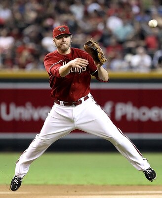 PHOENIX - SEPTEMBER 06:  Infielder Mark Reynolds #27 of the Arizona Diamondbacks fields a ground ball out during the Major League Baseball game against  the San Francisco Giants at Chase Field on September 6, 2010 in Phoenix, Arizona. The Giants defeated
