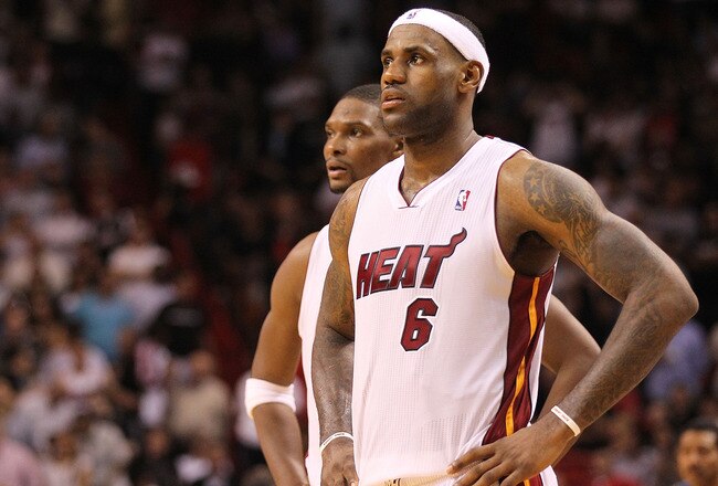 MIAMI, FL - NOVEMBER 29:  LeBron James #6 and Chris Bosh #1 of the Miami Heat look on during a game against the Washington Wizards at American Airlines Arena on November 29, 2010 in Miami, Florida. NOTE TO USER: User expressly acknowledges and agrees that