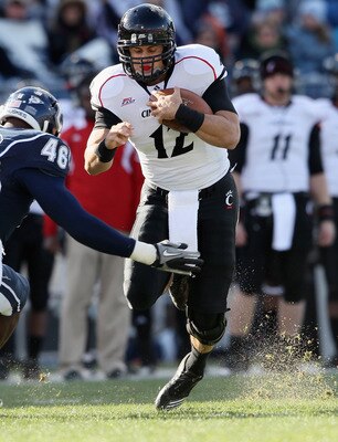EAST HARTFORD, CT - NOVEMBER 27:  Zach Collaros #12 of the Cincinnati Bearcats is hit by Sio Moore #46 of the Connecticut Huskies on November 27, 2010 at Rentschler Field in East Hartford, Connecticut.  (Photo by Elsa/Getty Images)