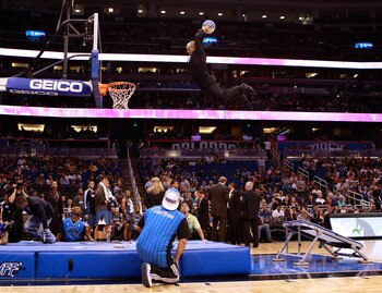 ORLANDO, FL - NOVEMBER 03:  An acrobat for the Orlando Magic performs during a timeout during the game against the Minnesota Timberwolves at Amway Arena on November 3, 2010 in Orlando, Florida.  NOTE TO USER: User expressly acknowledges and agrees that, b
