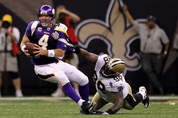 NEW ORLEANS - SEPTEMBER 09:  Sedrick Ellis #98 of the New Orleans Saints pulls down Brett Favre #4 of the Minnesota Vikings at Louisiana Superdome on September 9, 2010 in New Orleans, Louisiana. The Saints won 14-9. (Photo by Ronald Martinez/Getty Images)