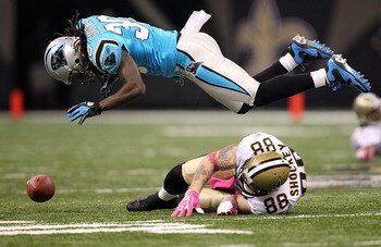 NEW ORLEANS - OCTOBER 03:  Tight end Jeremy Shockey #88 of the New Orleans Saints drops a pass against Charles Godfrey #30 of the Carolina Panthers at the Louisiana Superdome on October 3, 2010 in New Orleans, Louisiana.  (Photo by Ronald Martinez/Getty I